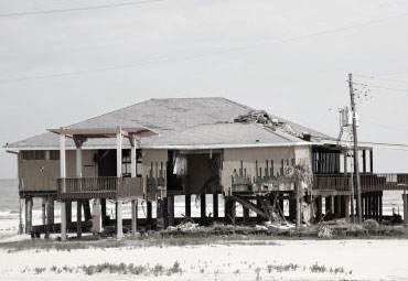 wind damage - spray foam can help prevent uplift to Garland roofs